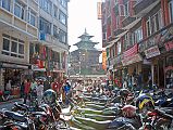 Kathmandu Durbar Square 06 05 Taleju Temple Motorcycles line the street at the north entrance to Kathmandu Durbar Square, with Taleju Temple visible the square.